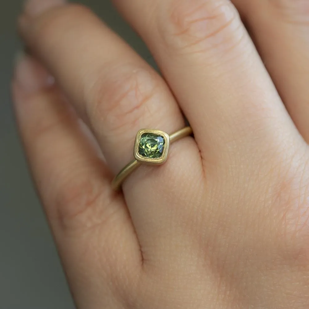 1.56ct Cushion Cut Sapphire With Milgrain Bezel Set In 18k Yellow Gold Brushed Finish